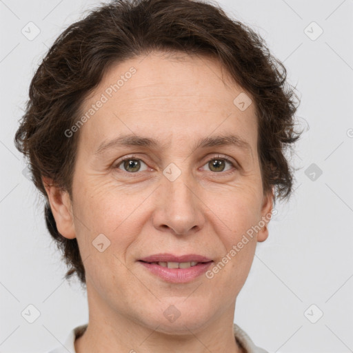 Joyful white adult female with short  brown hair and brown eyes