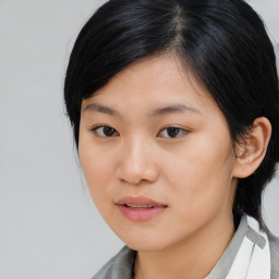 Joyful asian young-adult female with medium  black hair and brown eyes