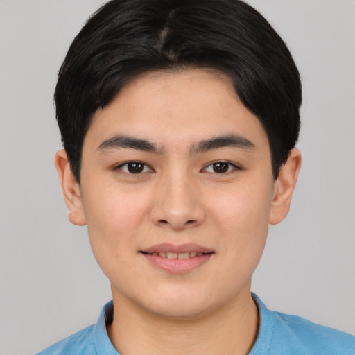 Joyful asian young-adult male with short  black hair and brown eyes