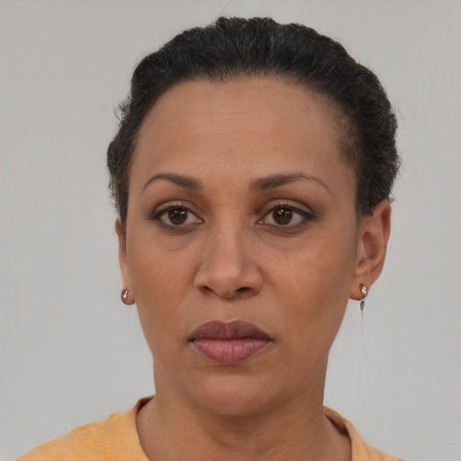 Neutral latino adult female with short  brown hair and brown eyes