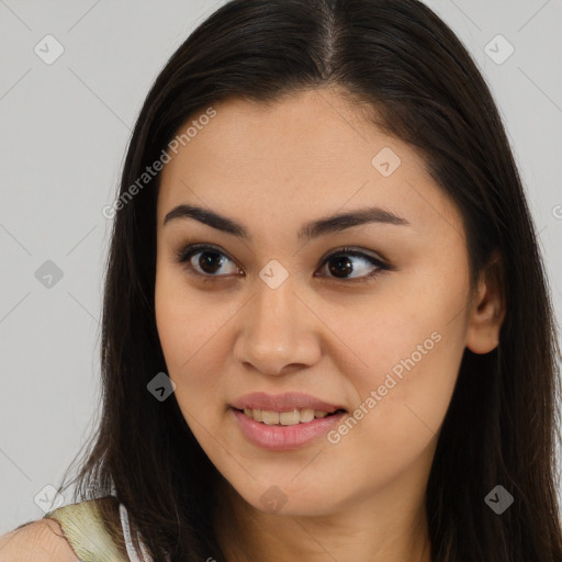 Joyful latino young-adult female with long  brown hair and brown eyes