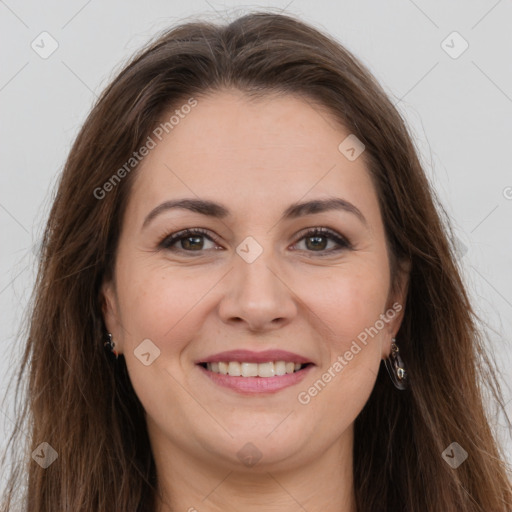 Joyful white adult female with long  brown hair and brown eyes