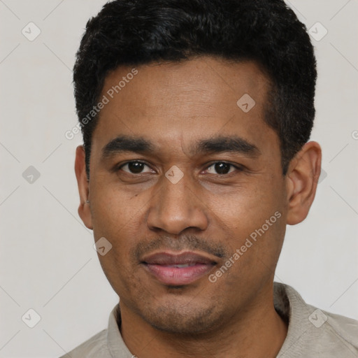 Joyful latino young-adult male with short  black hair and brown eyes