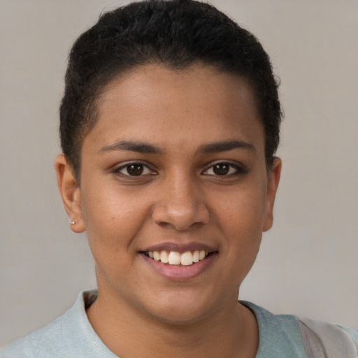 Joyful latino young-adult female with short  brown hair and brown eyes