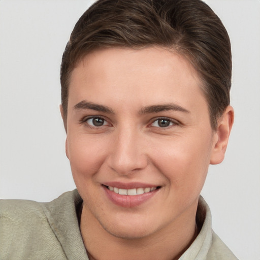 Joyful white young-adult female with short  brown hair and brown eyes