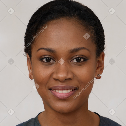 Joyful black young-adult female with short  black hair and brown eyes