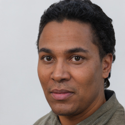 Neutral black adult male with short  black hair and brown eyes