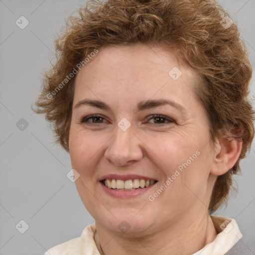 Joyful white adult female with short  brown hair and brown eyes