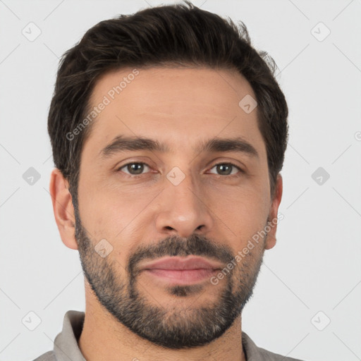 Joyful white young-adult male with short  black hair and brown eyes