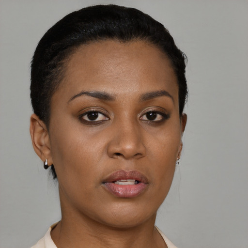 Neutral black young-adult female with short  brown hair and brown eyes