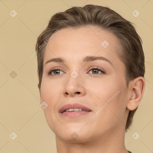 Joyful white young-adult female with short  brown hair and brown eyes