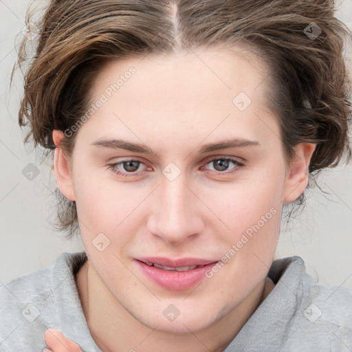 Joyful white young-adult female with medium  brown hair and blue eyes