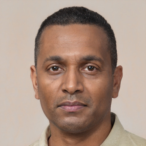 Neutral black young-adult male with short  black hair and brown eyes