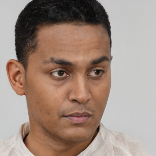 Neutral latino young-adult male with short  black hair and brown eyes
