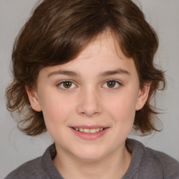 Joyful white child female with medium  brown hair and brown eyes