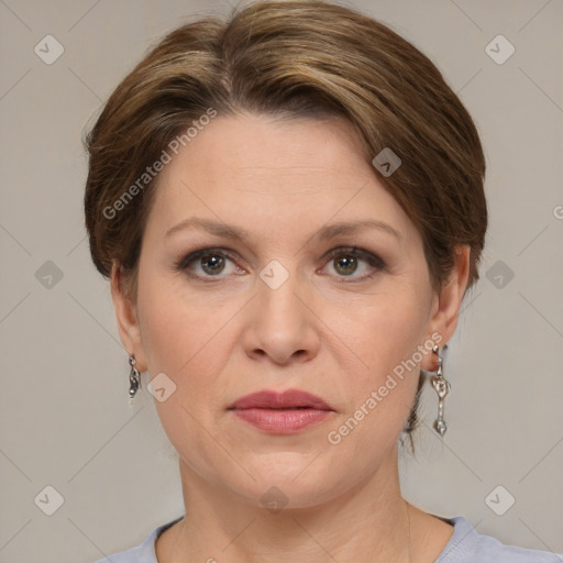 Joyful white adult female with medium  brown hair and grey eyes