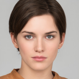 Neutral white young-adult female with short  brown hair and brown eyes