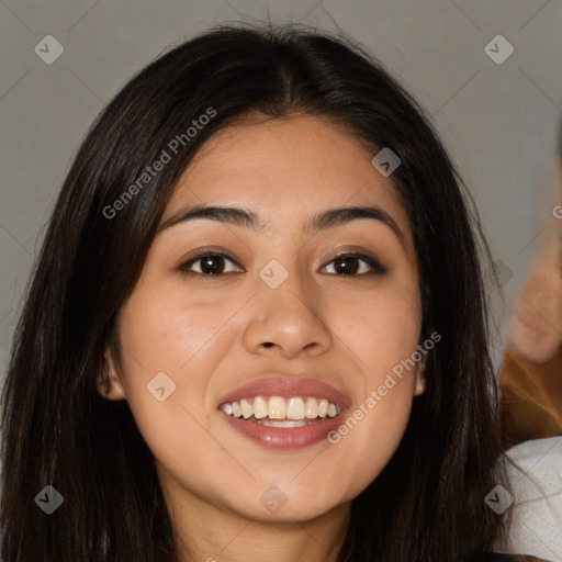 Joyful latino young-adult female with long  brown hair and brown eyes