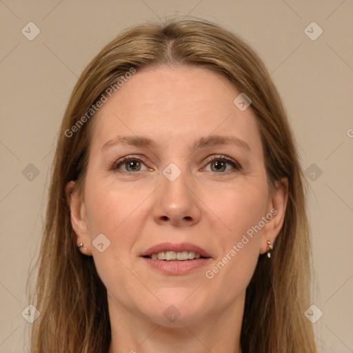 Joyful white adult female with long  brown hair and brown eyes