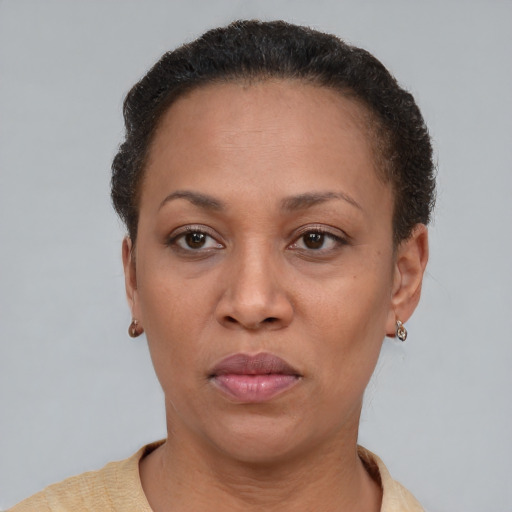 Neutral latino adult female with short  brown hair and brown eyes