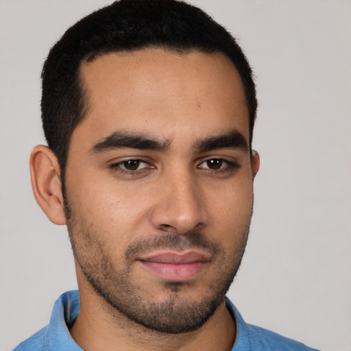 Neutral latino young-adult male with short  black hair and brown eyes