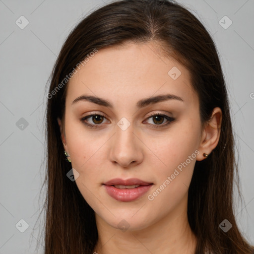 Joyful white young-adult female with long  brown hair and brown eyes