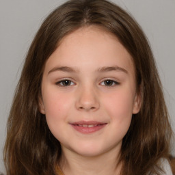 Joyful white child female with medium  brown hair and brown eyes