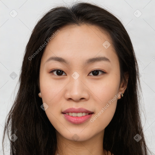 Joyful asian young-adult female with long  brown hair and brown eyes