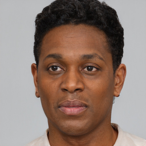 Neutral black young-adult male with short  black hair and brown eyes