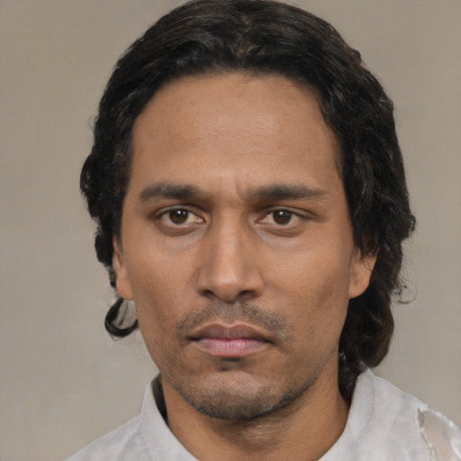 Neutral latino adult male with short  black hair and brown eyes