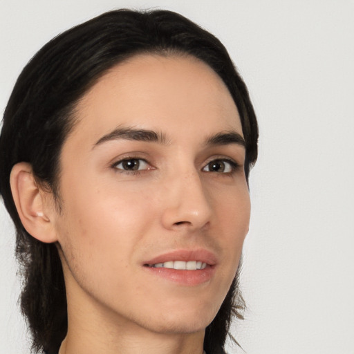 Joyful white young-adult female with long  black hair and brown eyes