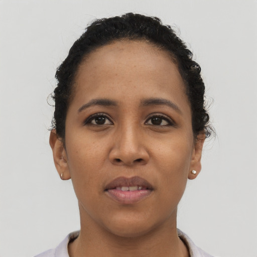 Neutral latino young-adult female with short  black hair and brown eyes