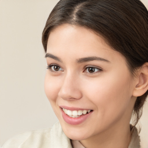 Joyful white young-adult female with medium  brown hair and brown eyes