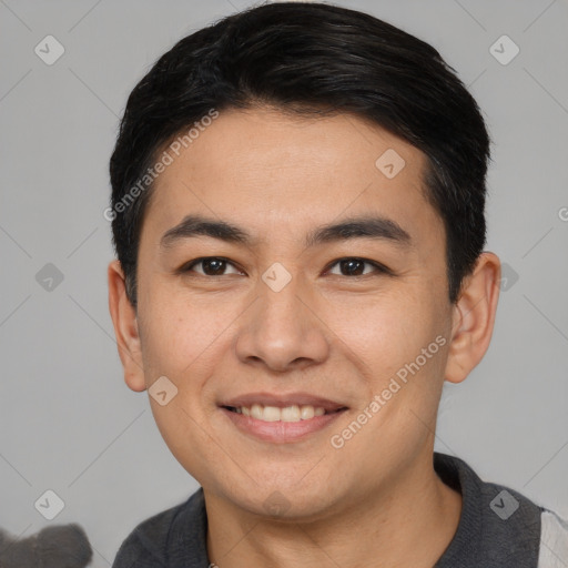 Joyful asian young-adult male with short  black hair and brown eyes