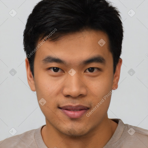 Joyful asian young-adult male with short  black hair and brown eyes