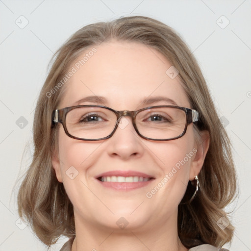 Joyful white adult female with medium  brown hair and blue eyes