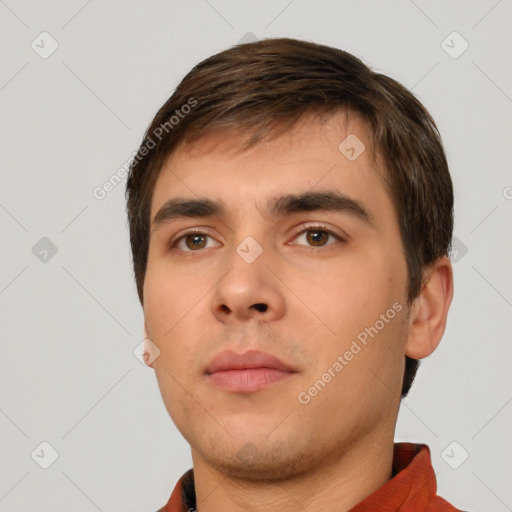 Neutral white young-adult male with short  brown hair and brown eyes