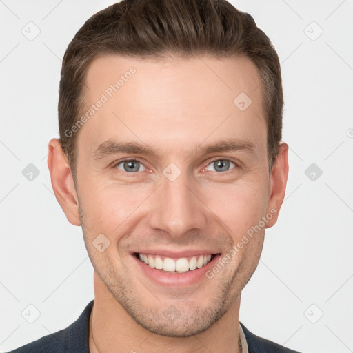 Joyful white young-adult male with short  brown hair and grey eyes