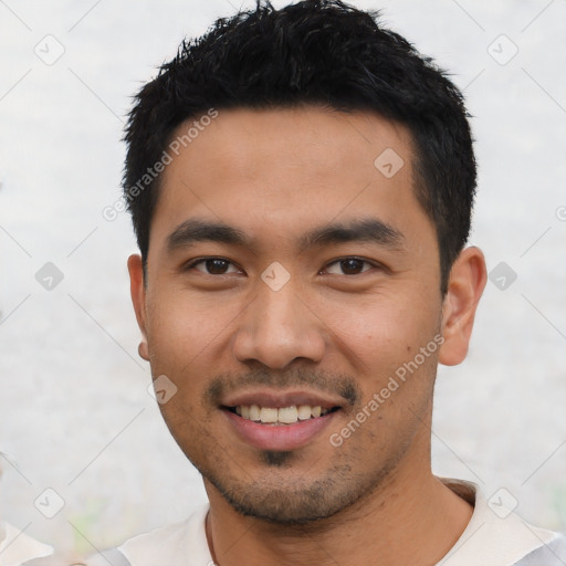 Joyful asian young-adult male with short  black hair and brown eyes