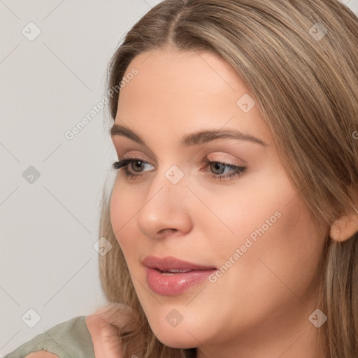 Neutral white young-adult female with long  brown hair and brown eyes