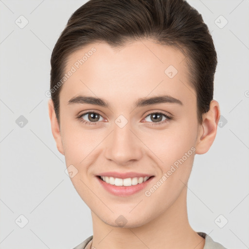 Joyful white young-adult female with short  brown hair and brown eyes