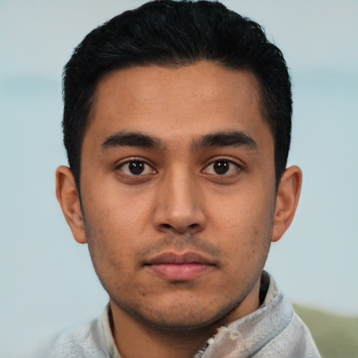 Neutral latino young-adult male with short  brown hair and brown eyes