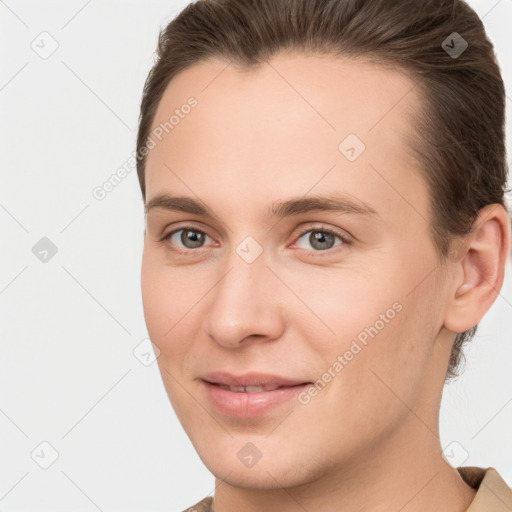 Joyful white young-adult female with short  brown hair and brown eyes