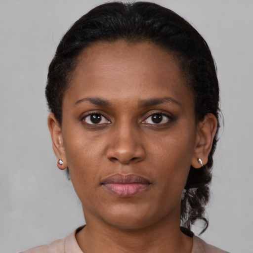 Neutral black young-adult female with short  brown hair and brown eyes
