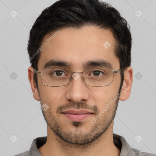 Joyful white young-adult male with short  black hair and brown eyes