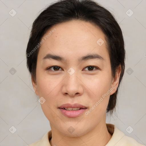 Joyful asian young-adult female with medium  brown hair and brown eyes