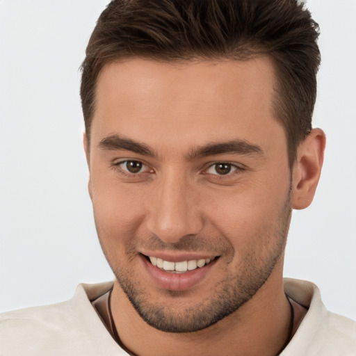 Joyful white young-adult male with short  brown hair and brown eyes