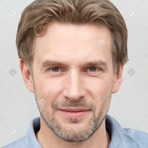 Joyful white adult male with short  brown hair and grey eyes