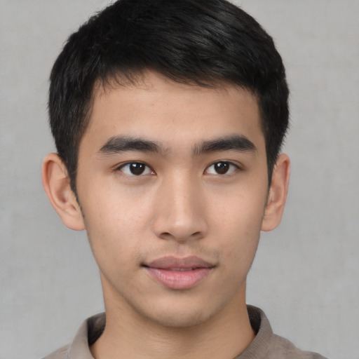 Neutral asian young-adult male with short  brown hair and brown eyes