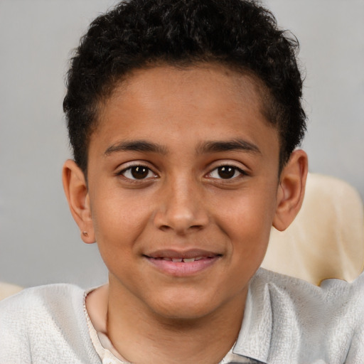Joyful latino child male with short  brown hair and brown eyes